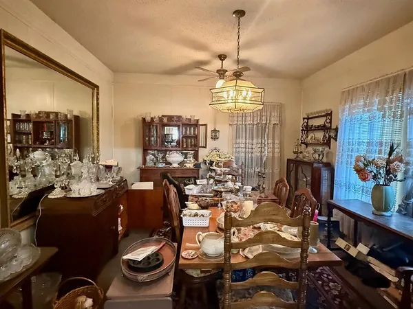 a living room with lots of furniture and a flat screen tv