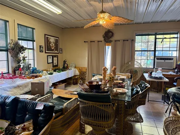 a kitchen with stainless steel appliances kitchen island granite countertop a sink and a stove with wooden floor