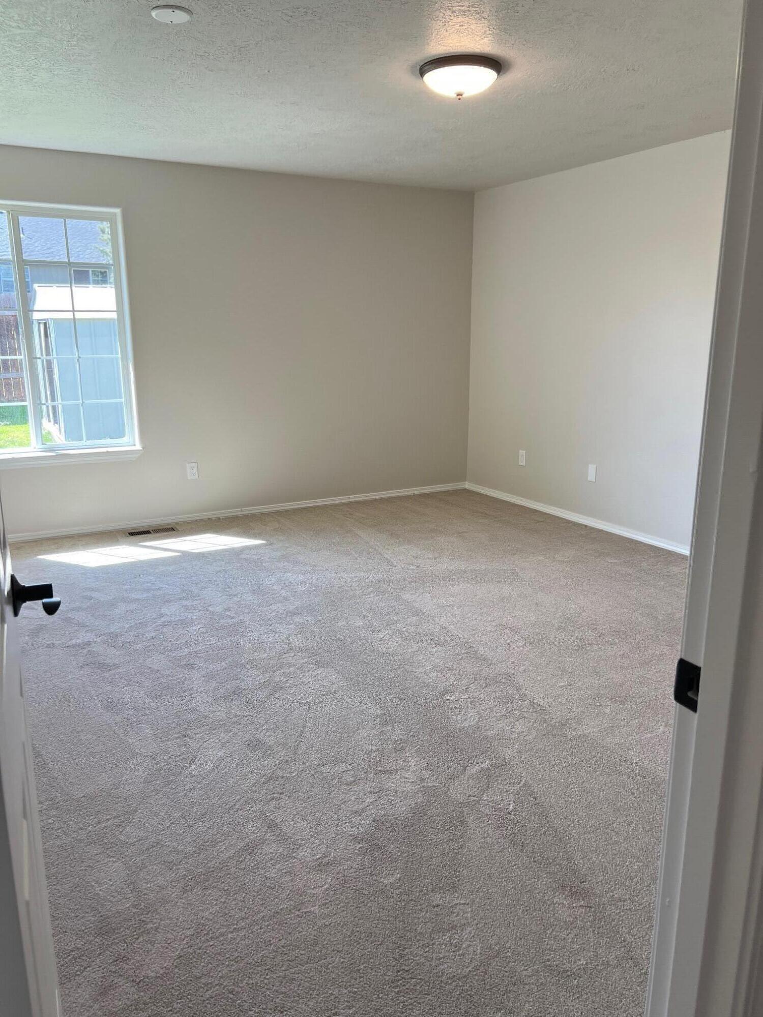 629 Deer Ridge Court Madras, OR 97741 - Photo 18 of 39 an empty room with windows
