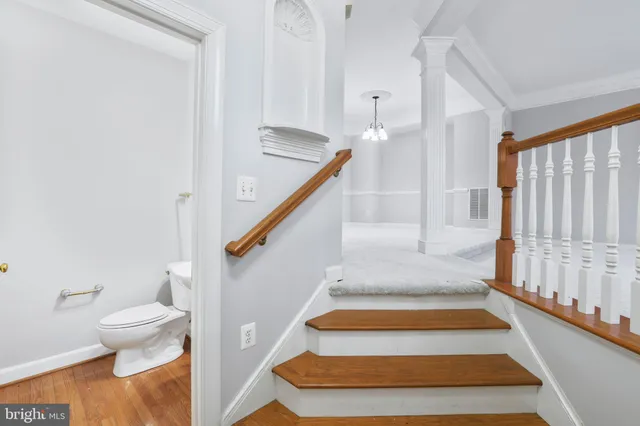 a bathroom with a toilet and a bathtub