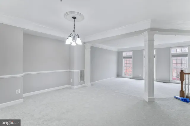 a view of a room with cabinet and mirrors