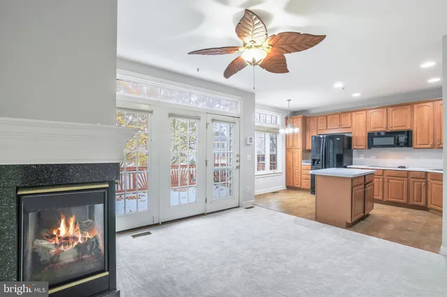a view of a kitchen with a stove cabinets and a fireplace