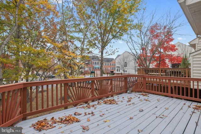 a view of a wooden deck with a yard