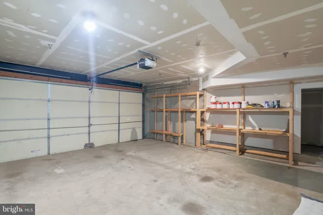 a view of a patio with table and chairs and potted plants