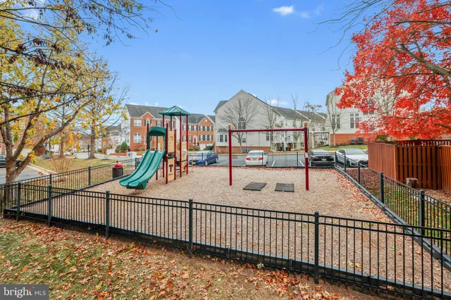 a view of a yard with large trees