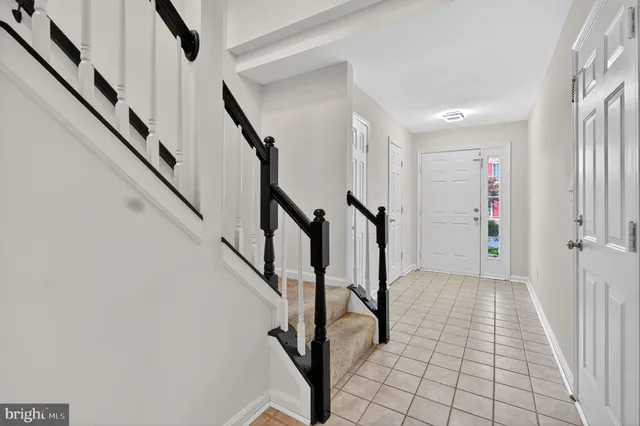 a view of entryway with stairs and wooden floor