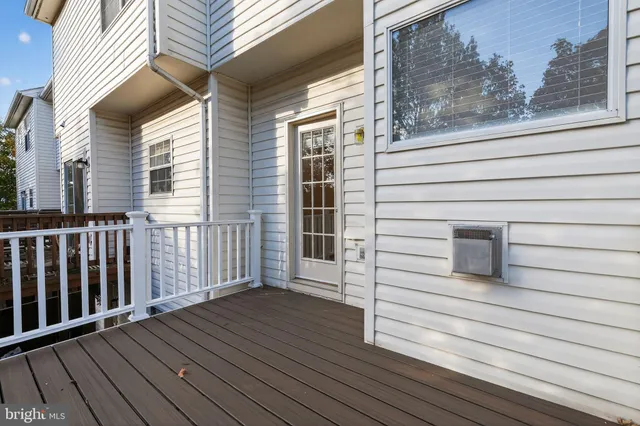 a view of a balcony with wooden floor