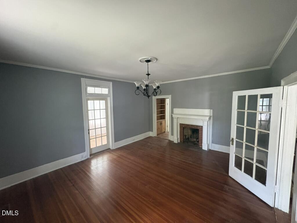 512 Raleigh Street Oxford, NC 27565 - Photo 7 of 30 Living room w sunroom