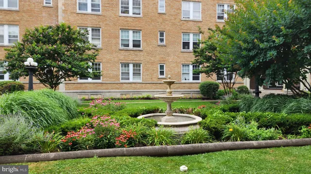 a view of a building with a garden
