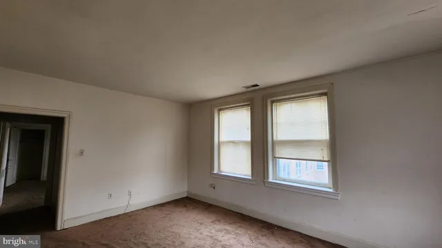 an empty room with windows