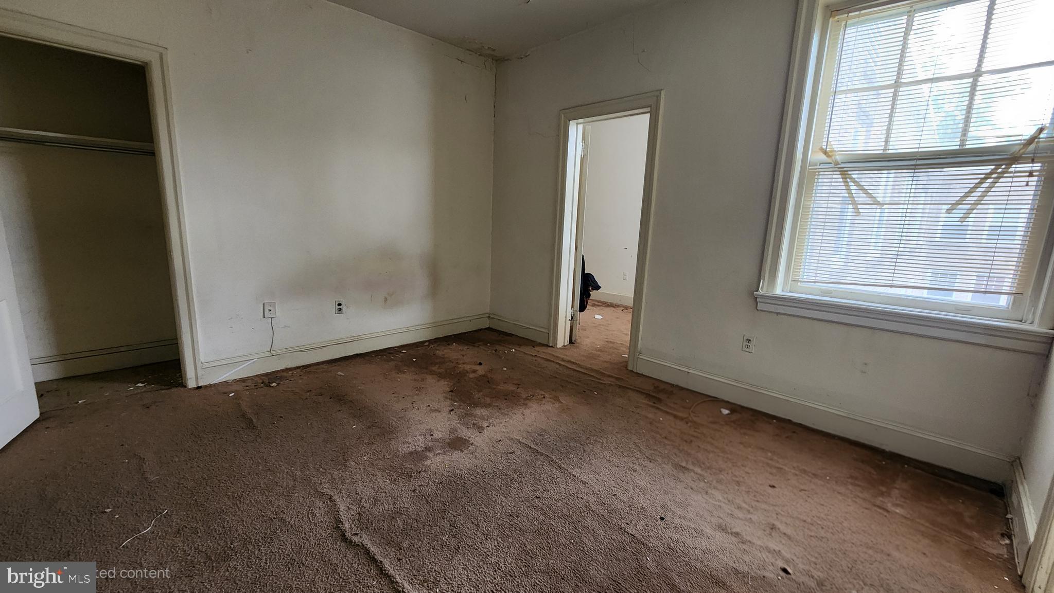 6655 McCallum Street, Unit 409 Philadelphia, PA 19119 - Photo 6 of 12 an empty room with windows