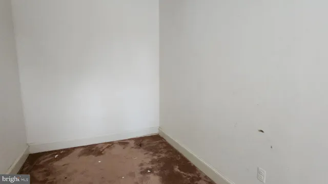 a view of a garden with a building in the background