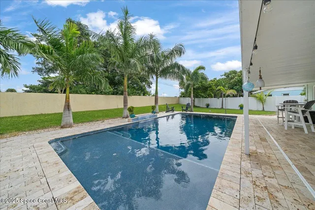 a view of yard with swimming pool