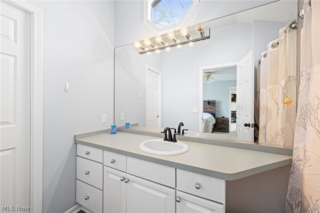 5352 Jaycox Road North Ridgeville, OH 44039 - Photo 22 of 27 Primary en suite bathroom with ceiling fan and oversized vanity