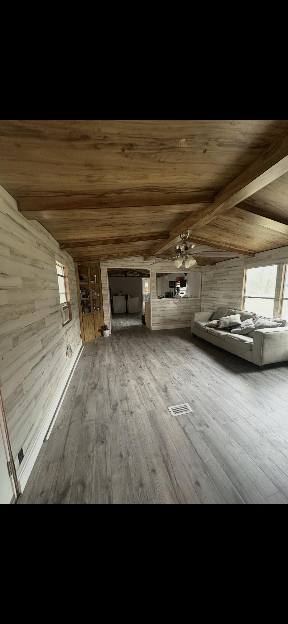 2984 B Goodman Hill Road Chipley, FL 32428 - Photo 3 of 14 a view of a room with wooden floor