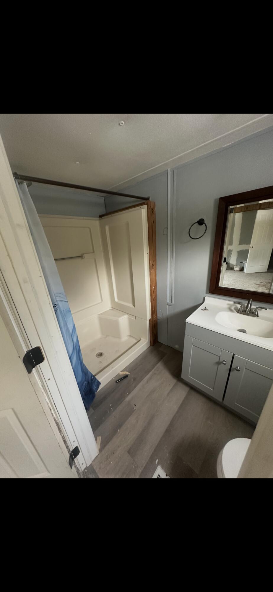 2984 B Goodman Hill Road Chipley, FL 32428 - Photo 9 of 14 a bedroom with a bed and mirror