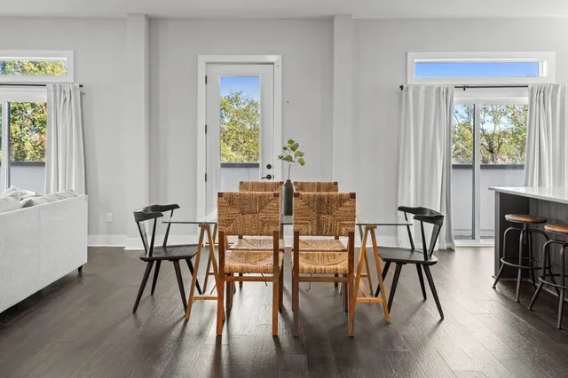 a view of a dining room with furniture window and wooden floor