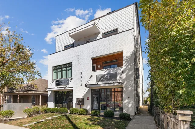 a front view of a building with street view