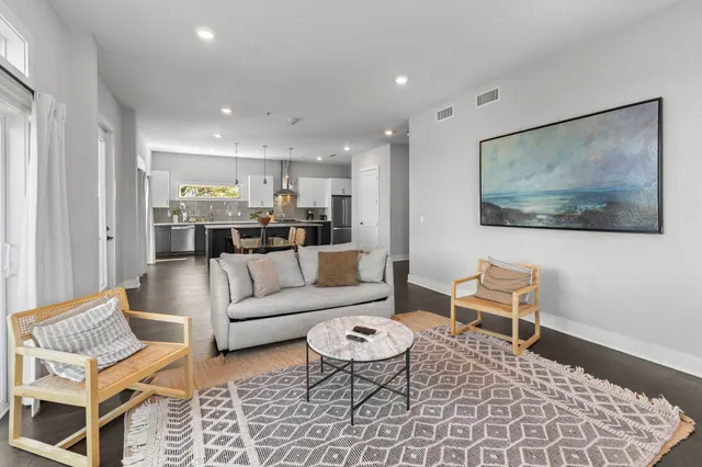 a living room with furniture and a rug