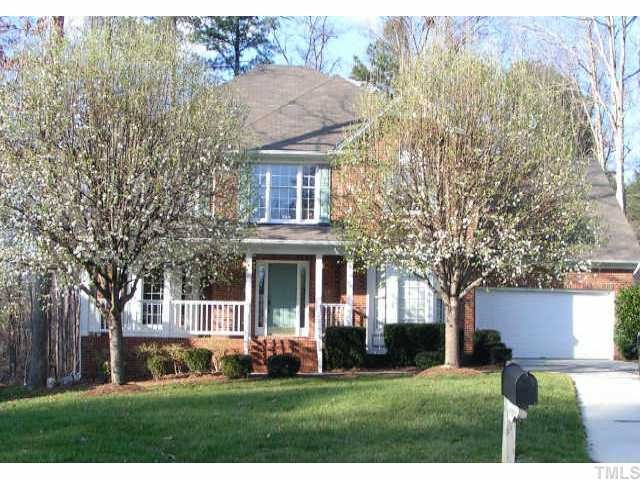 12329 Timbercroft Court Raleigh, NC 27613 - Photo 1 of 1 a front view of a house with a yard and trees