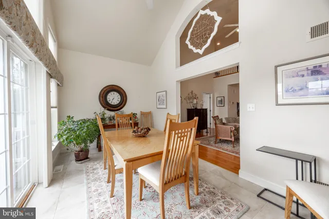 a living room with furniture a window and a table