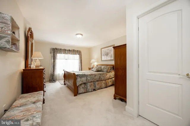 a bathroom with a sink a toilet and shower curtain