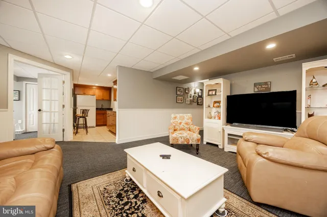 a kitchen with refrigerator and cabinets