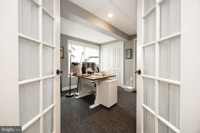 a bathroom with a toilet a sink and a mirror