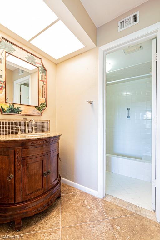 3662 Arctic Circle, Unit 201 Naples, FL 34112 - Photo 20 of 35 a bathroom with a sink and a mirror