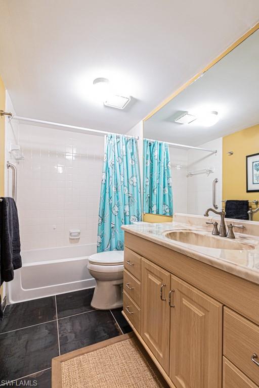 3662 Arctic Circle, Unit 201 Naples, FL 34112 - Photo 27 of 35 a bathroom with a granite countertop sink toilet a large mirror a bathtub and shower