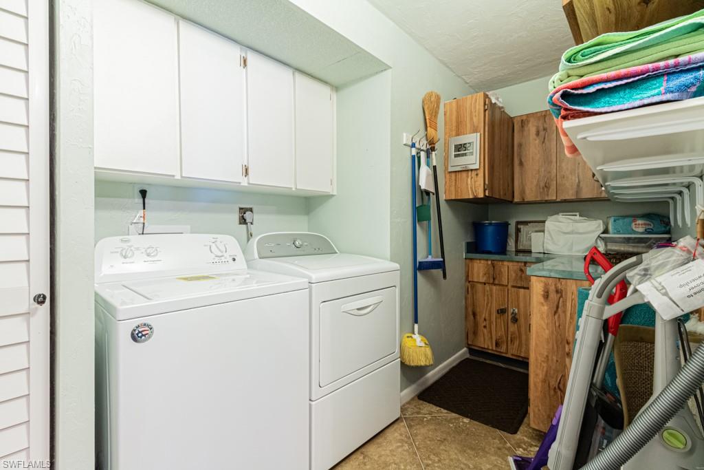 3662 Arctic Circle, Unit 201 Naples, FL 34112 - Photo 28 of 35 a utility room with dryer and washer