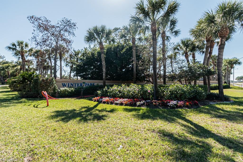 3662 Arctic Circle, Unit 201 Naples, FL 34112 - Photo 34 of 35 a view of a backyard with plants and large trees