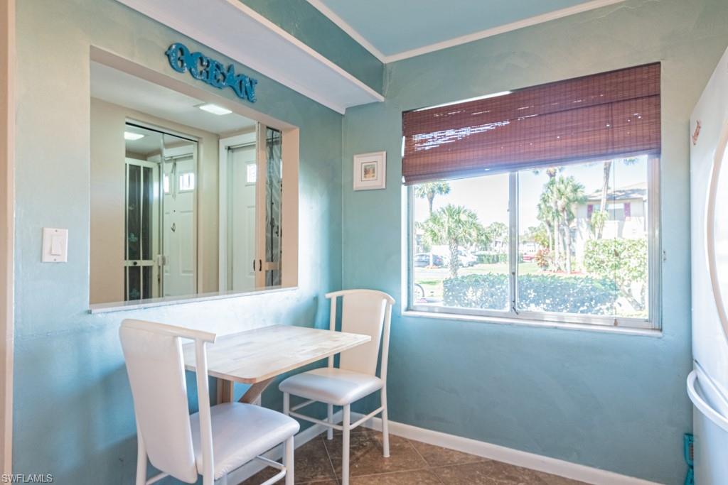 3662 Arctic Circle, Unit 201 Naples, FL 34112 - Photo 5 of 35 a dining room with furniture and window