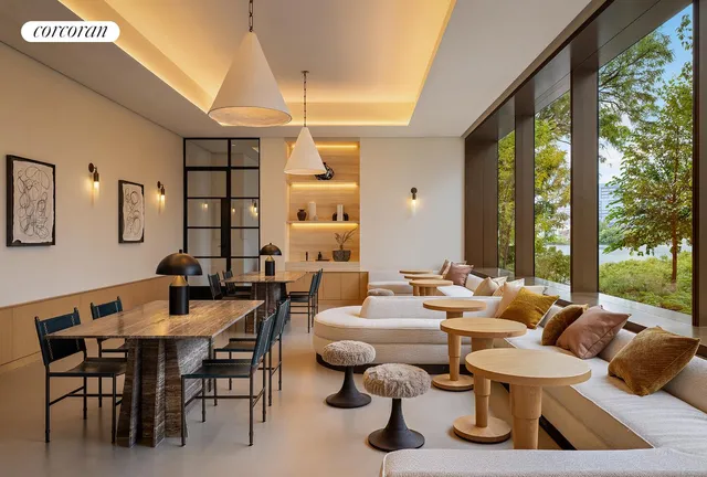 a living room with patio furniture and a large window