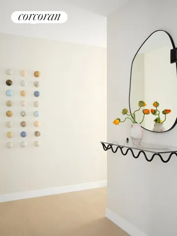 a living room with couches chairs and a dining table with wooden floor