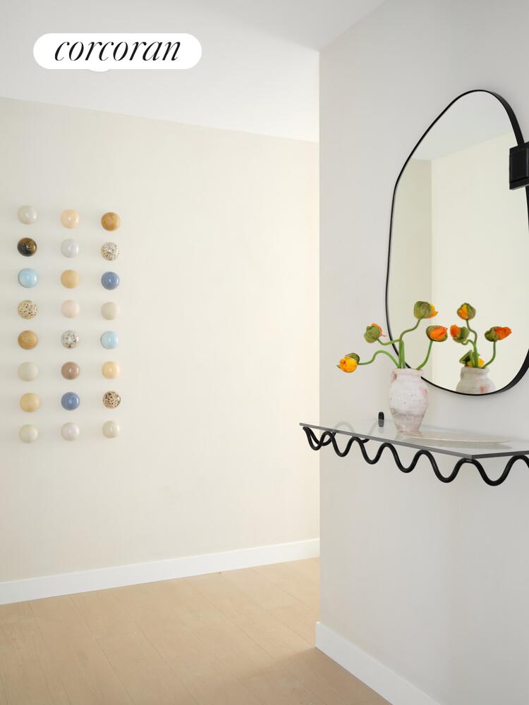 482 Kent Avenue, Unit PHB Brooklyn, NY 11249 - Photo 5 of 28 a bathroom with a sink and a mirror