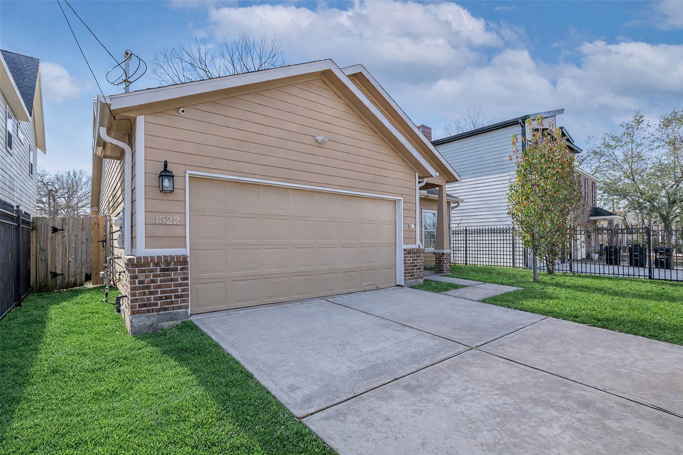 a front view of a house with a garden