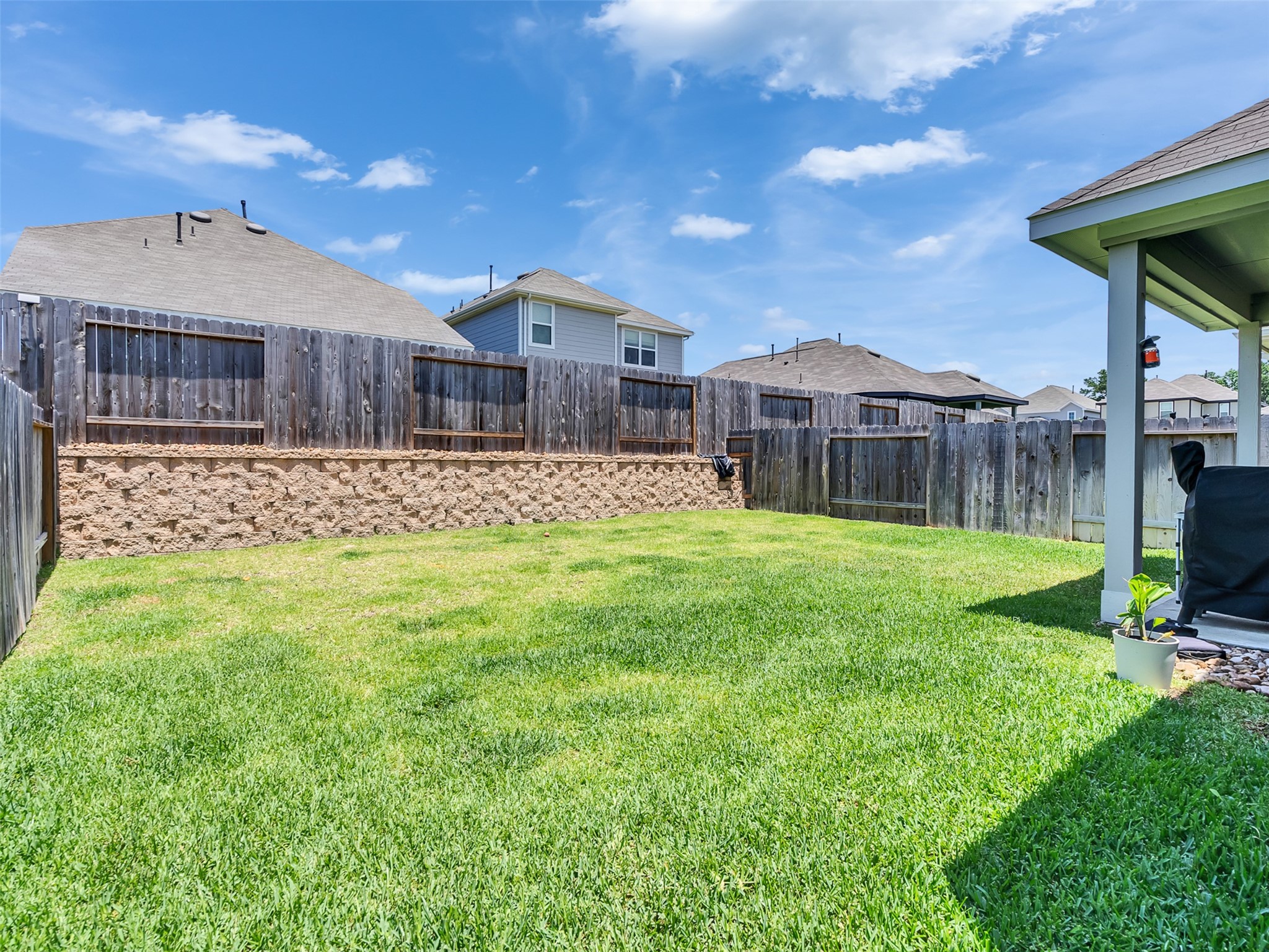 2416 Bluefish Court Conroe, TX 77384 - Photo 18 of 45 a view of a house with a yard