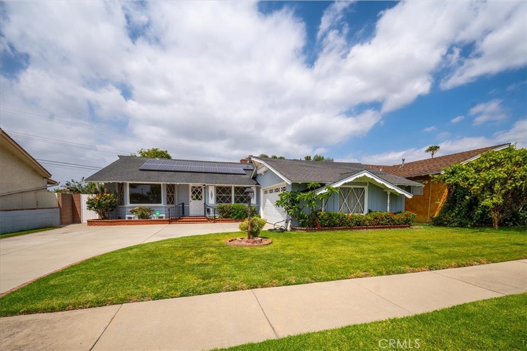 6481 Dos Rios Road Downey, CA 90240 - Photo 15 of 27 a view of house with a big yard and potted plants