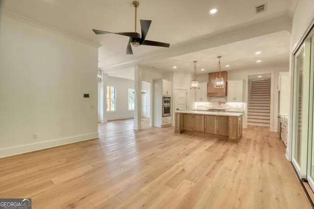 a view of a kitchen with a sink and a window