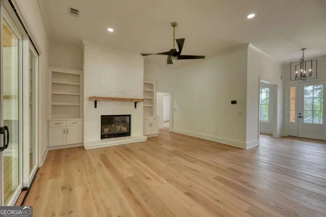 a bathroom with a double vanity sink a mirror a bathtub and shower