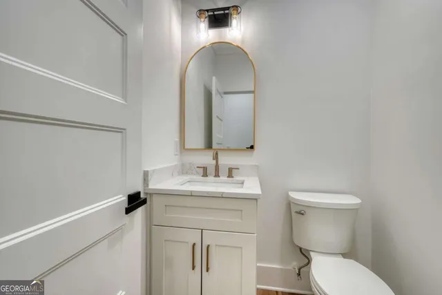 a view of an empty room with wooden walls