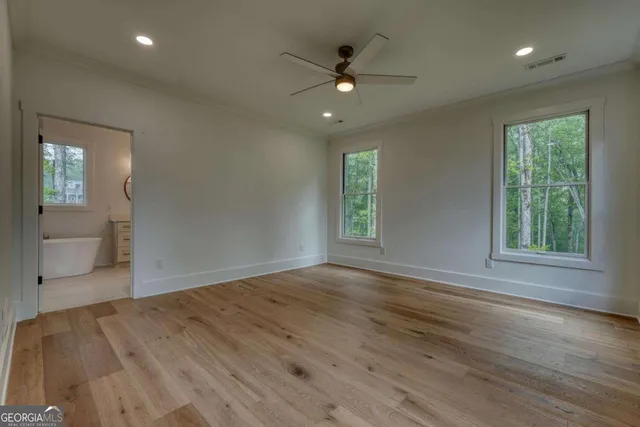 a view of empty room with wooden walls