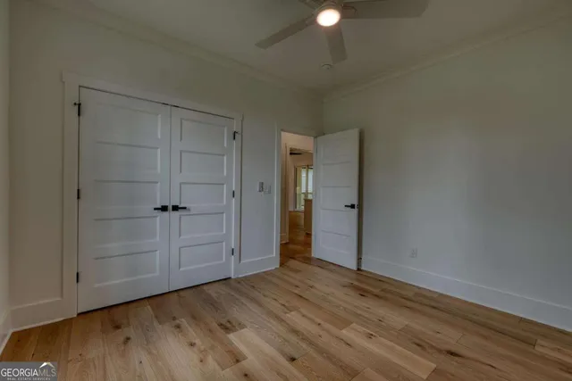 a living room with furniture a table and a flat screen tv