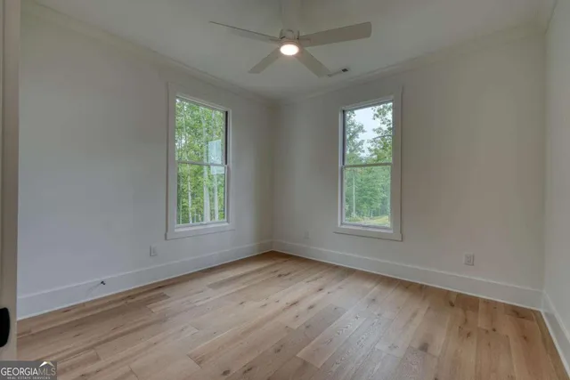 a view of a swimming pool with seating space