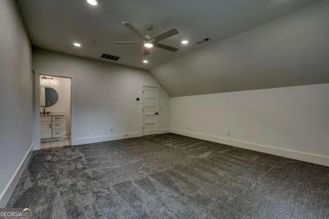 a view of a balcony with chairs and wooden floor