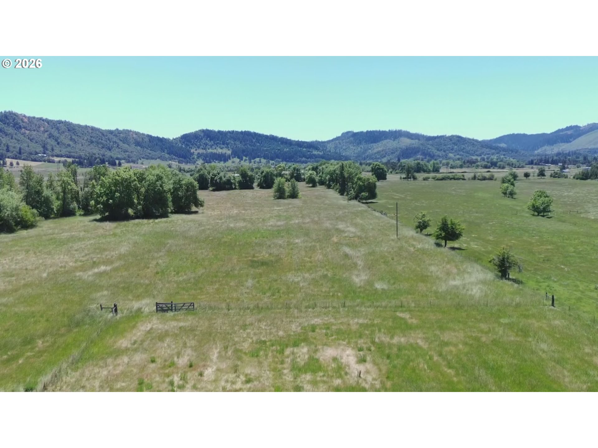 6404 Lookingglass Road Roseburg, OR 97471 - Photo 2 of 48 a open area with mountains in the background