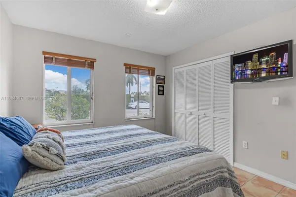 a bed room with a bed and a window