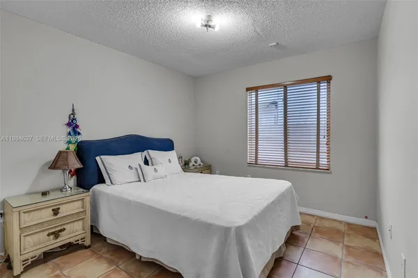 a bedroom with a bed and a cabinets