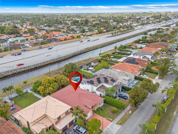 an aerial view of residential houses with outdoor space